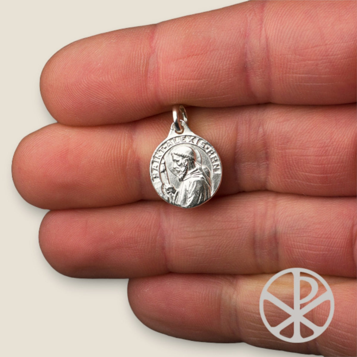 Medalla de San Alejo de Roma en plata - sobre una mano